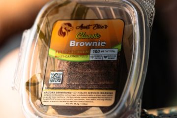 Kick Your Weekend Aunt Ellie's Classic Brownie sitting sunkissed on the table. tucson edibles