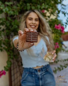 High Times Briana showing off the back of the classic brownie. Halo Infusions. full spectrum. best edibles in arizona. tucson edibles