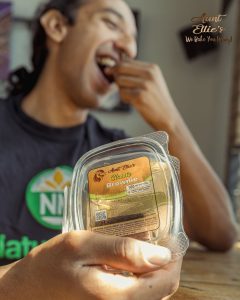 A Timeless Treat Luis taking a bite out of a classic brownie. Aunt Ellie's. 100mg. Halo Infusions. Full Spectrum. best edibles in arizona. tucson edibles