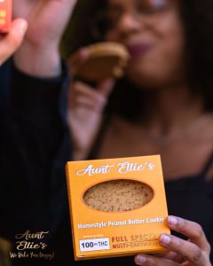 Favorite Flavor Ella eating a Homestyle PB 100mg Cookie. Aunt Ellie's. full spectrum. best edibles in arizona. tucson edibles